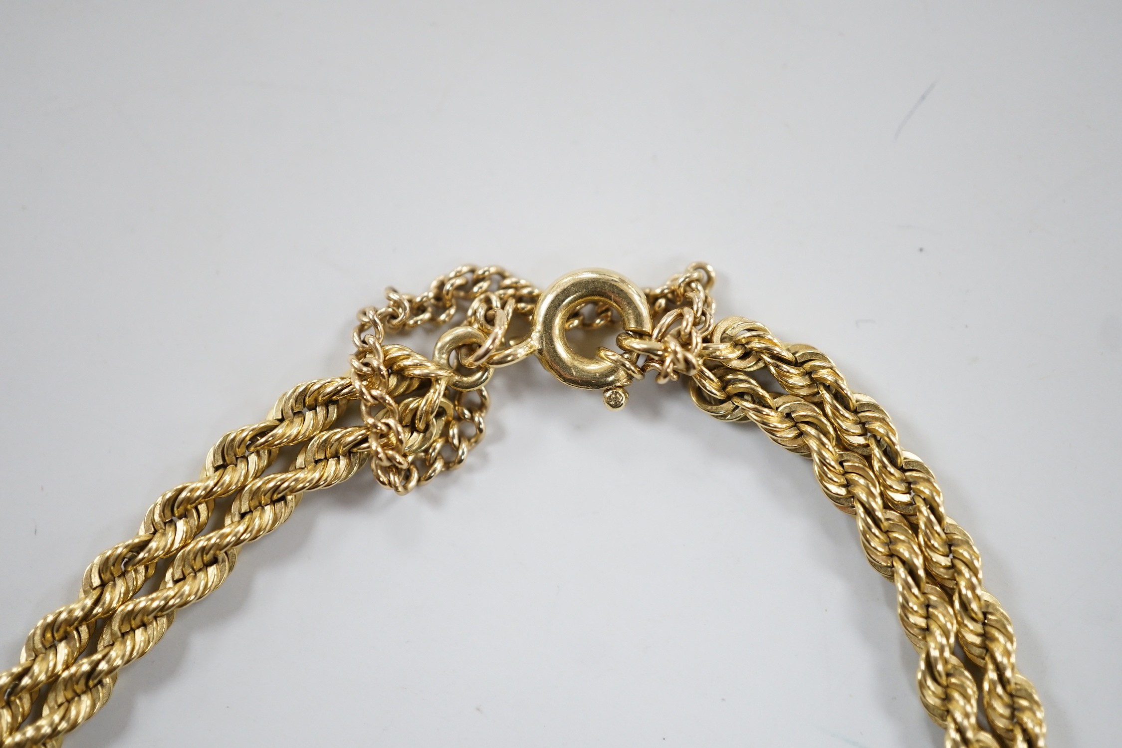 A modern yellow metal twin stand rope twist bracelet, 18cm, 17.4 grams.